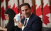 Minister of Public Safety Marco Mendicino arrives along with fellow federal ministers to make an announcement regarding border measures and COVID-19 during a press conference in Ottawa on Friday, Nov. 19, 2021. THE CANADIAN PRESS/Sean Kilpatrick