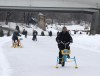 Sinan Leylek, co-founder of Spark Rental’s Ice Cycles, front, rides one of the ice bikes on a frozen river in Winnipeg on Tuesday, Jan. 11, 2022. THE CANADIAN PRESS/Kelly Malone