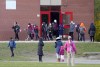 Parents pick up their children as they are dismissed from Dixie Public School during the COVID-19 pandemic in Mississauga, Ont., on November 22, 2021. THE CANADIAN PRESS/Nathan Denette