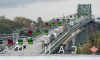 Trucks line up on the Peace Bridge in Fort Erie, Ont. as they enter the United States on Wednesday October 21, 2020. THE CANADIAN PRESS/Frank Gunn