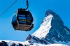 FILE - A 'Matterhorn-Express' gondola lift in front of Matterhorn mountain in the Zermatt ski resort, in Zermatt, Switzerland, March 18, 2020. Skiing’s newest downhill course that crosses between Switzerland and Italy next to the Matterhorn mountain will have its debut World Cup races in October, the International Ski Federation said Friday. (Jean-Christophe Bott/Keystone via AP, File)