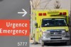 An ambulance is shown outside a hospital in Montreal, Saturday, Jan. 15, 2022, as the COVID-19 pandemic continues in Canada. THE CANADIAN PRESS/Graham Hughes