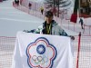 In this photo provided by Szollos Peter, Ray Ho is holds a flag in Italy on Feb. 26, 2019, created to represent Chinese Taipei, the name under which Taiwan competes under in international sporting competitions. Under an agreement struck by the Taiwan government and the IOC in 1981 they compete under the name and flag of Chinese Taipei after a referendum to change their name to Taiwan failed in 2018. (Szollos Peter via AP)