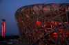 FILE - The National Stadium and the Beijing Olympic Tower are lit in red on the eve of the Chinese New Year ahead of the 2022 Winter Olympics, Jan. 31, 2022, in Beijing. (AP Photo/Jae C. Hong, File)