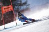 FILE - Italy's Sofia Goggia speeds down the course during an alpine ski, women's World Cup downhill, in Cortina d'Ampezzo, Italy, Jan. 22, 2022. Goggia, the reigning gold medalist in the women’s downhill, is hoping to compete in Beijing, even though she sprained her left knee and fractured a bone in her leg during a race in January. (AP Photo/Gabriele Facciotti, File)
