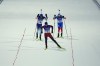 Johannes Thingnes Boe of Norway pulls ahead of Quentin Fillon Maillet of France, left, and Eduard Latypov of the Russian Olympic Committee at the finish line during the 4x6-kilometer mixed relay at the 2022 Winter Olympics, Saturday, Feb. 5, 2022, in Zhangjiakou, China. (AP Photo/Kirsty Wigglesworth)