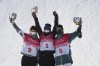 From left, silver medalist United States's Julia Marino, gold medalist New Zealand's Zoi Sadowski Synnott and bronze medalist Australia's Tess Coady celebrate after the women's slopestyle finals at the 2022 Winter Olympics, Sunday, Feb. 6, 2022, in Zhangjiakou, China. (AP Photo/Gregory Bull)