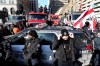 Trucks attempting to drive down University Avenue between Bloor Street and Queen's Park are blocked by a police cruiser during a demonstration in support of a trucker convoy in Ottawa protesting COVID-19 restrictions, in Toronto, Saturday, Feb. 5, 2022. Police forces across Canada took different approaches to protests against COVID-19 measures over the weekend, learning from the situation in Ottawa, where demonstrators and their trucks remain entrenched in the capital’s core more than a week later. THE CANADIAN PRESS/Nathan Denette