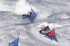 Poland's Aleksandra Krol crashes as Czech Republic's Ester Ledecka advances during the women's parallel giant slalom finals at the 2022 Winter Olympics, Tuesday, Feb. 8, 2022, in Zhangjiakou, China. (AP Photo/Gregory Bull)