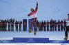 Gold medalist Austria's Benjamin Karl celebrates during the venue ceremony for the men's parallel giant slalom at the 2022 Winter Olympics, Tuesday, Feb. 8, 2022, in Zhangjiakou, China. (AP Photo/Gregory Bull)