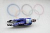 Emily Sweeney, of the United States, slides during the luge women's singles run 3 at the 2022 Winter Olympics, Tuesday, Feb. 8, 2022, in the Yanqing district of Beijing. (AP Photo/Dmitri Lovetsky)