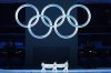 FILE - The Olympic flag is carried into the stadium during the opening ceremony of the 2022 Winter Olympics, Feb. 4, 2022, in Beijing. (AP Photo/Jae C. Hong, File)