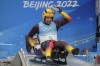 Tobias Wendl and Tobias Arlt, of Germany, prepare to start the luge doubles run 1 at the 2022 Winter Olympics, Wednesday, Feb. 9, 2022, in the Yanqing district of Beijing. (AP Photo/Mark Schiefelbein)
