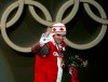 FILE - Canada's Duff Gibson celebrates his gold medal during the ceremony for the men's Skeleton competition at the Turin 2006 Winter Olympic Games in Turin, Italy, Feb 18, 2006. Gibson has published a book called “The Tao of Sport” in which he details his mental approach and explains why he thinks that is the difference-maker for elite athletes. (AP Photo/Domenico Stinellis, File)