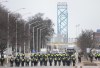 Police walk the line to remove all truckers and supporters after a court injunction gave police the power to enforce the law after protesters blocked the access leading from the Ambassador Bridge, linking Detroit and Windsor, as truckers and their supporters continue to protest against COVID-19 vaccine mandates and restrictions, in Windsor, Ont., Sunday, Feb. 13, 2022. THE CANADIAN PRESS/Nathan Denette