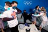 From left, Nikita Katsalapov of the Russian Olympic Commitee, Zachary Donohue of the U.S., Evan Bates of the U.S., Madison Chock of the U.S., and Victoria Sinitsina of the Russian Olympic Committee are seen in the Green Room after competing in the ice dance figure skating at the 2022 Winter Olympics, Monday, Feb. 14, 2022, in Beijing. (Antonin Thuillier/Pool Photo via AP)