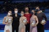 From left, silver medal finishers Victoria Sinitsina and Nikita Katsalapov, of the Russian Olympic Committee, gold medal finishers Gabriella Papadakis and Guillaume Cizeron, of France, and bronze medal finishers Madison Hubbell and Zachary Donohue, of the United States, pose during a venue ceremony after the ice dance competition during the figure skating at the 2022 Winter Olympics, Monday, Feb. 14, 2022, in Beijing. (AP Photo/David J. Phillip)