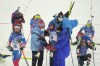 Ingrid Landmark Tandrevold of Norway is helped off the track after the women's 10-kilometer pursuit race at the 2022 Winter Olympics, Sunday, Feb. 13, 2022, in Zhangjiakou, China. (AP Photo/Kirsty Wigglesworth)