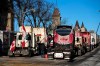 A person walks among trucks as Wellington Street is lined with trucks during a protest against COVID-19 measures that has grown into a broader anti-government protest, in Ottawa, on Monday, Feb. 14, 2022. THE CANADIAN PRESS/Justin Tang