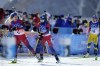 Tiril Eckhoff of Norway (6) and Marte Olsbu Roeiseland of Norway (2) arrive at the shooting range during the women's 12.5-kilometer mass start biathlon at the 2022 Winter Olympics, Friday, Feb. 18, 2022, in Zhangjiakou, China. (AP Photo/Frank Augstein)