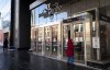 A person tries to open the locked doors of the Rideau Centre mall, closed since Jan. 5, after its management was told by police that the safety of its businesses could not be guaranteed, as a protest against COVID-19 restrictions continued in Ottawa on Monday, Feb. 7, 2022. Ottawa's largest shopping mall confirmed it would reopen Tuesday for the first time in three weeks. THE CANADIAN PRESS/Justin Tang