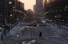 A person crosses Wellington St. inside the restricted area, Wednesday, Feb. 23, 2022 in Ottawa. Ottawa police say they will continue to hold a perimeter around downtown as they try to maintain peace and order in the capital without the extra powers afforded them under the Emergencies Act.THE CANADIAN PRESS/Adrian Wyld