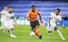 FILE - Shakhtar's Marlon, center, tries to go past Real Madrid's Karim Benzema, left and Vinicius Junior, during a Group D Champions League soccer match at the Santiago Bernabeu stadium in Madrid Spain, Nov. 3, 2021. The Brazilian soccer player from one of Ukraine's biggest clubs issued an appeal to the Brazilian government on Thursday, Feb. 24, 2022, saying they are trapped by the Russian military attack on Ukraine. The Ukrainian league was suspended indefinitely Thursday after martial law was declared in Ukraine. (AP Photo/Manu Fernandez, File)