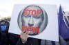 Protesters hold posters and Ukrainian flags as they protest against Russia's military intervention in Ukraine in front of the Russia Embassy in Sofia, Thursday, Feb. 24, 2022. THE CANADIAN PRESS/AP/Valentina Petrova