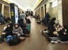 People sit in the Kyiv subway, using it as a bomb shelter in Kyiv, Ukraine, Thursday, Feb. 24, 2022. Canada should prepare to provide asylum to those fleeing the violence, says a Canadian security expert in Ukraine. THE CANADIAN PRESS/AP-Zoya Shu