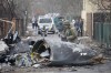 A Ukrainian Army soldier inspects fragments of a downed aircraft in Kyiv, Ukraine, Friday, Feb. 25, 2022. It was unclear what aircraft crashed and what brought it down amid the Russian invasion in Ukraine. THE CANADIAN PRESS/AP/Vadim Zamirovsky