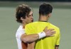 Russia's Andrey Rublev, left, comforts Poland's Hubert Hurkacz, after he beats him during a semifinal match of the Dubai Duty Free Tennis Championship in Dubai, United Arab Emirates, Friday, Feb. 25, 2022. (AP Photo/Kamran Jebreili)