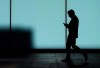 A man walks and texts on his smart phone in downtown Toronto on Monday, October 30, 2017. Canadian phone companies are waiving long-distance and text charges for calls to Ukraine amid Russia's assault on the country.THE CANADIAN PRESS/Nathan Denette