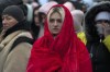 Refugees, mostly women and children, wait for transportation after fleeing from the Ukraine and arriving at the border crossing in Medyka, Poland, Monday, March 7, 2022. Hundreds of thousands of Ukrainian civilians attempting to flee to safety Sunday were forced to shelter from Russian shelling that pummeled cities in Ukraine’s center, north and south. (AP Photo/Markus Schreiber)