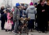 Children warm up around a fire as they arrive in a humanitarian aid center, for displaced persons fleeing Ukraine, in Przemysl, Poland, Tuesday, March 8, 2022. U.N. officials said Tuesday that the Russian onslaught has forced more than 2 million people to flee Ukraine. (AP Photo/Czarek Sokolowski)