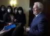 Former Quebec premier Jean Charest speaks to reporters as he arrives for an event in Ottawa on Wednesday, March 2, 2022. THE CANADIAN PRESS/Justin Tang