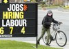 A woman checks out a jobs advertisement sign during the COVID-19 pandemic in Toronto on Wednesday, April 29, 2020. Canada's jobless rate has tumbled below pre-pandemic levels, creating a candidate-driven market where job postings abound but workers are hard to find. THE CANADIAN PRESS/Nathan Denette