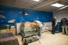 Volunteer Pavlo Kopchak, with the Second Front Ukraine Foundation, packs protective equipment and supplies into a suitcase for civilians in Ukraine, at their warehouse in Vaughn, Ont., on Tuesday, March 15, 2022. THE CANADIAN PRESS/ Tijana Martin