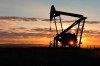 FILE - In this Nov. 6, 2013 file photo, a Whiting Petroleum Co. pumpjack pulls crude oil from the Bakken region of the Northern Plains near Bainville, Mont. U.S. oil production has been bouncing back as the industry recovers from the pandemic but industry analysts say it will take months for significant further increases to materialize despite calls to pump more domestic crude. (AP Photo/Matthew Brown, File)