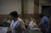 Medical staff rest in a basement used as a bomb shelter at the Ohmatdyt children's hospital in Kyiv, Ukraine, Saturday, March 19, 2022. (AP Photo/Felipe Dana)