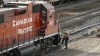 An employee boards a Canadian Pacific Railway locomotive at a yard in Calgary, Alta., Friday, March 18, 2022. A spokesman for Teamsters Canada Rail Conference says the union is expecting to be back at the bargaining table with a mediator today after a labour dispute with CP Rail led a work stoppage late Saturday.THE CANADIAN PRESS/Jeff McIntosh