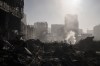 Firefighters extinguish a fire near a shopping center after shelling, in Kyiv, Ukraine, Monday, March 21, 2022. (AP Photo/Felipe Dana)