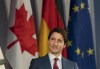 Canadian Prime Minister Justin Trudeau smiles as he listens to a speaker at an event in Berlin, Germany, Wednesday, March 9, 2022. The prime minister will address the European Parliament in Brussels this week before meeting with counterparts from the NATO military alliance to discuss Russia's invasion of Ukraine. THE CANADIAN PRESS/Adrian Wyld