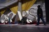 A person walks along the red carpet during preparations for Sunday's 94th Academy Awards outside the Dolby Theatre on Friday, March 25, 2022, in Los Angeles. (AP Photo/John Locher)