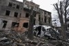 A damaged building and car after recent shelling, in the center of Kharkiv, Ukraine, Sunday, March 27, 2022. THE CANADIAN PRESS/AP/Efrem Lukatsky