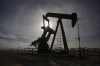 A pumpjack works at a well head on an oil and gas installation near Cremona, Alta., Saturday, Oct. 29, 2016.Calfrac Well Services Ltd. says it is suspending any investments in Russia. THE CANADIAN PRESS/Jeff McIntosh