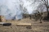 Ukrainian soldiers of the 103rd Separate Brigade of the Territorial Defense of the Armed Forces, fire their weapons, during a training exercise, at an undisclosed location, near Lviv, western Ukraine, Tuesday, March 29, 2022. (AP Photo/Nariman El-Mofty)