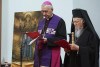 The spiritual leader of the world's Orthodox Christians, Ecumenical Patriarch Bartholomew I, right, and Archbishop Stanisław Gądecki, the head of the Polish Bishops' Conference, stand together as they meet with Ukrainian refugees in Warsaw, Poland, on March 29, 2022. Bartholomew denounced Russia's invasion of Ukraine as an 