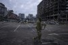 A soldier walks the amid the destruction caused after shelling of a shopping center last March 21 in Kyiv, Ukraine, Wednesday, March 30, 2022. (AP Photo/Rodrigo Abd)