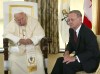 Pope John Paul II sits with then-prime minister Jean Chretien during a meeting at Morrow Park in Toronto Saturday July 27, 2002. Pope Francis said Friday in Rome he would be coming to Canada, making him the second Pontiff ever to do so. (CP PHOTO/Kevin Frayer)