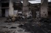 Burned cars and warehouses near the Antonov airport in Hostomel, outskirts of Kyiv, Ukraine, Monday, April 4, 2022. Canadians who want to take up arms to help Ukraine say they've faced unexpected obstacles. THE CANADIAN PRESS/AP-Felipe Dana